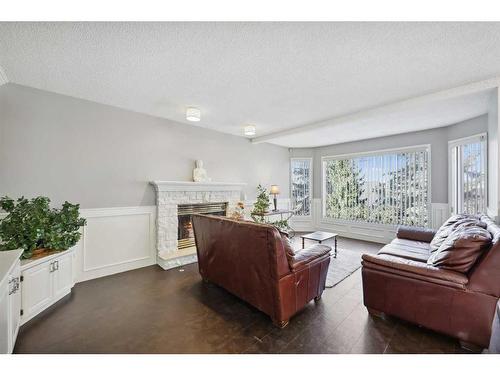 1360 Shawnee Road Sw, Calgary, AB - Indoor Photo Showing Living Room With Fireplace