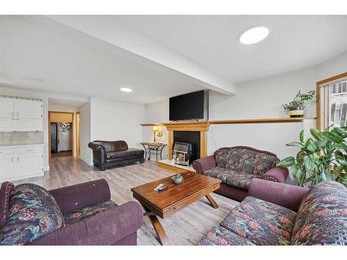 1360 Shawnee Road Sw, Calgary, AB - Indoor Photo Showing Living Room With Fireplace