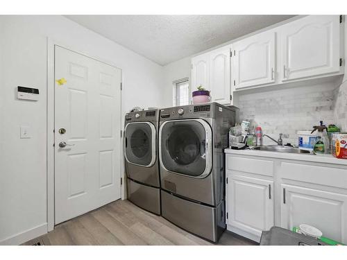 1360 Shawnee Road Sw, Calgary, AB - Indoor Photo Showing Laundry Room