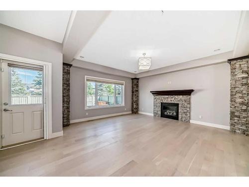 113 West Coach Place Sw, Calgary, AB - Indoor Photo Showing Living Room With Fireplace