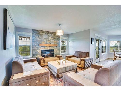 31055 Elbow River Drive, Rural Rocky View County, AB - Indoor Photo Showing Living Room With Fireplace