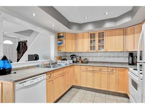 113-3809 45 Street Sw, Calgary, AB - Indoor Photo Showing Kitchen With Double Sink