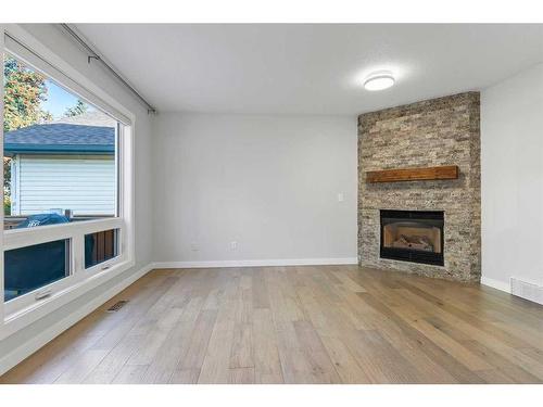 50 Shawbrooke Crescent Sw, Calgary, AB - Indoor Photo Showing Living Room With Fireplace