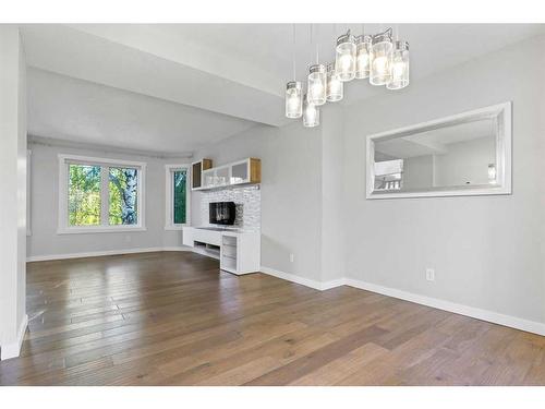 50 Shawbrooke Crescent Sw, Calgary, AB - Indoor Photo Showing Other Room With Fireplace