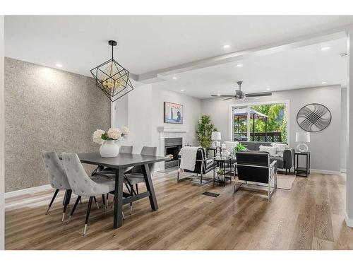 9137 21 Street Se, Calgary, AB - Indoor Photo Showing Dining Room With Fireplace