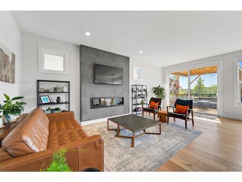 52 Seton Rise Se, Calgary, AB - Indoor Photo Showing Living Room With Fireplace