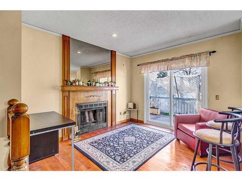 48 Martingrove Way Ne, Calgary, AB - Indoor Photo Showing Living Room With Fireplace