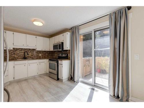 243 Berwick Drive Nw, Calgary, AB - Indoor Photo Showing Kitchen With Stainless Steel Kitchen