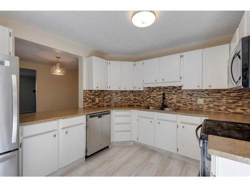 243 Berwick Drive Nw, Calgary, AB - Indoor Photo Showing Kitchen With Stainless Steel Kitchen