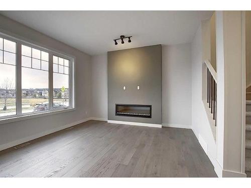 56 Shale Avenue, Cochrane, AB - Indoor Photo Showing Living Room With Fireplace