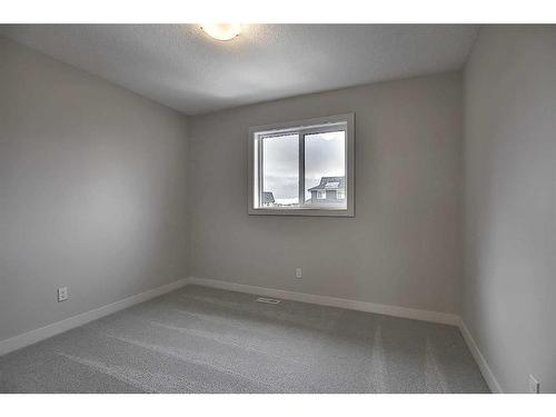 56 Shale Avenue, Cochrane, AB - Indoor Photo Showing Other Room