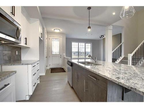 56 Shale Avenue, Cochrane, AB - Indoor Photo Showing Kitchen With Double Sink With Upgraded Kitchen