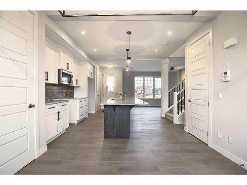 56 Shale Avenue, Cochrane, AB - Indoor Photo Showing Kitchen With Upgraded Kitchen