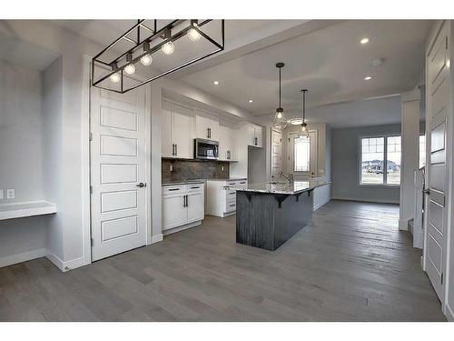 56 Shale Avenue, Cochrane, AB - Indoor Photo Showing Kitchen With Upgraded Kitchen