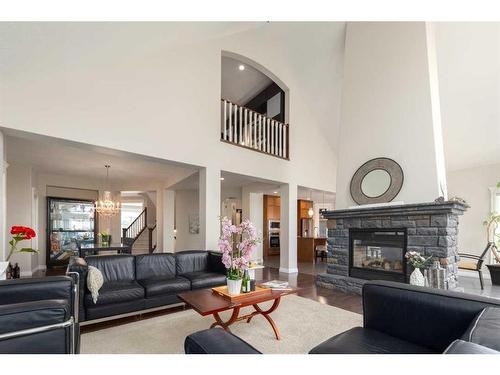 8 Spring Willow Place Sw, Calgary, AB - Indoor Photo Showing Living Room With Fireplace