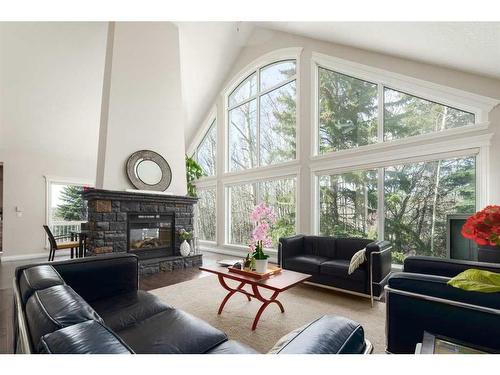 8 Spring Willow Place Sw, Calgary, AB - Indoor Photo Showing Living Room With Fireplace