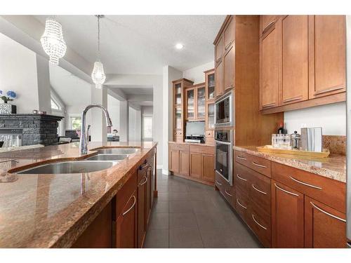 8 Spring Willow Place Sw, Calgary, AB - Indoor Photo Showing Kitchen With Double Sink