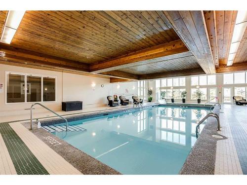 126-6868 Sierra Morena Boulevard Sw, Calgary, AB - Indoor Photo Showing Other Room With In Ground Pool