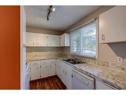 703-120 Silvercreek Close Nw, Calgary, AB - Indoor Photo Showing Kitchen With Double Sink