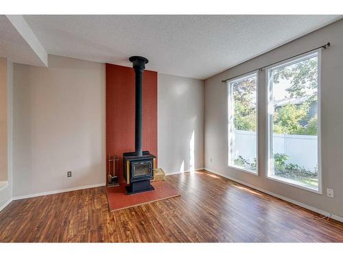 703-120 Silvercreek Close Nw, Calgary, AB - Indoor With Fireplace