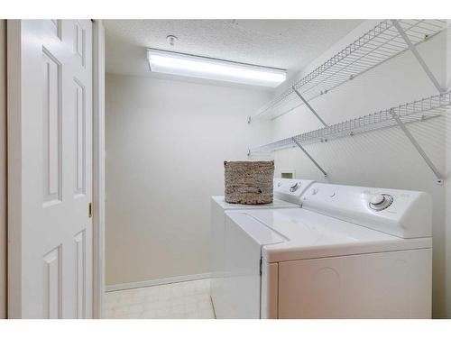 1301-1000 Sienna Park Green Sw, Calgary, AB - Indoor Photo Showing Laundry Room