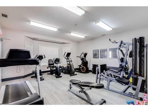 1301-1000 Sienna Park Green Sw, Calgary, AB - Indoor Photo Showing Gym Room