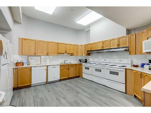 1301-1000 Sienna Park Green Sw, Calgary, AB - Indoor Photo Showing Kitchen