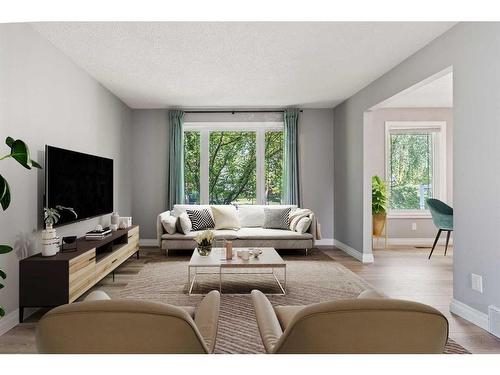 876 Mckenzie Drive Se, Calgary, AB - Indoor Photo Showing Living Room