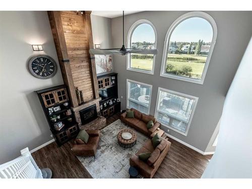 1107 Highland Green View Nw, High River, AB - Indoor With Fireplace