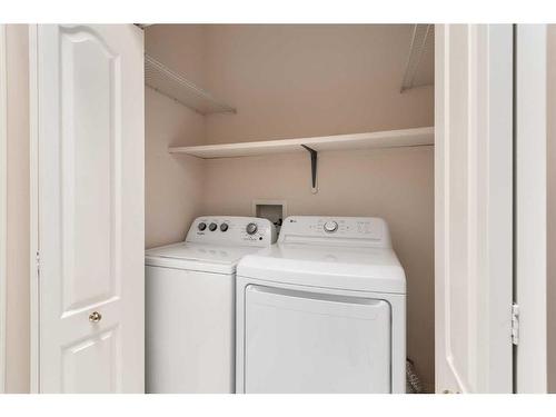 61 Scimitar Heath Nw, Calgary, AB - Indoor Photo Showing Laundry Room