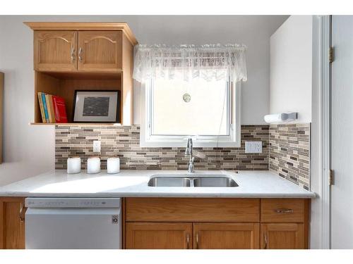 61 Scimitar Heath Nw, Calgary, AB - Indoor Photo Showing Kitchen With Double Sink