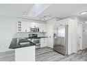 80 Douglas Ridge Circle Se, Calgary, AB  - Indoor Photo Showing Kitchen With Stainless Steel Kitchen With Double Sink With Upgraded Kitchen 