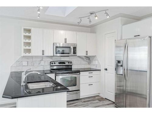 80 Douglas Ridge Circle Se, Calgary, AB - Indoor Photo Showing Kitchen With Stainless Steel Kitchen With Upgraded Kitchen