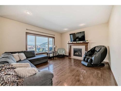 124 Aspenmere Close, Chestermere, AB - Indoor Photo Showing Living Room With Fireplace