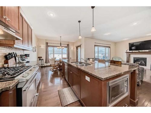 124 Aspenmere Close, Chestermere, AB - Indoor Photo Showing Kitchen With Double Sink With Upgraded Kitchen