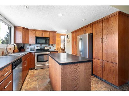 32 Deermont Road Se, Calgary, AB - Indoor Photo Showing Kitchen With Stainless Steel Kitchen With Double Sink