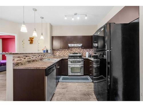 2306-1140 Taradale Drive Ne, Calgary, AB - Indoor Photo Showing Kitchen With Upgraded Kitchen