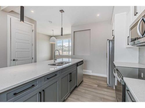 256 Waterford Heath, Chestermere, AB - Indoor Photo Showing Kitchen With Double Sink With Upgraded Kitchen