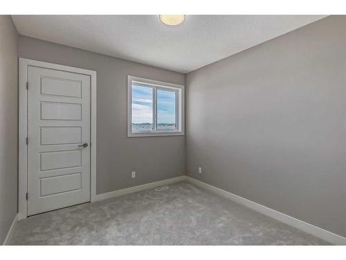 256 Waterford Heath, Chestermere, AB - Indoor Photo Showing Other Room