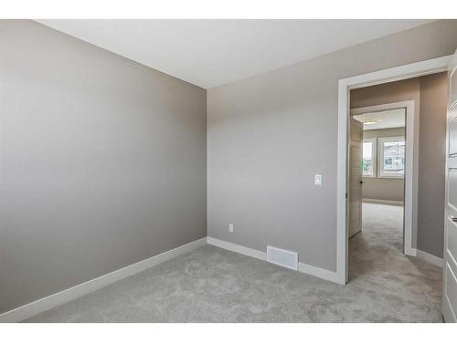 256 Waterford Heath, Chestermere, AB - Indoor Photo Showing Other Room