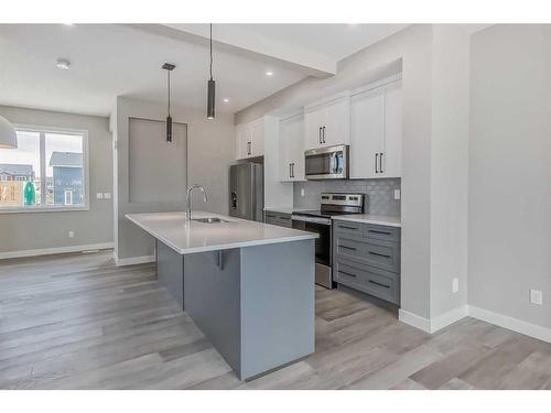 256 Waterford Heath, Chestermere, AB - Indoor Photo Showing Kitchen With Upgraded Kitchen