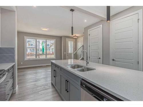 256 Waterford Heath, Chestermere, AB - Indoor Photo Showing Kitchen With Double Sink