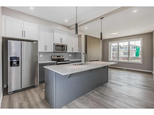 256 Waterford Heath, Chestermere, AB - Indoor Photo Showing Kitchen With Double Sink With Upgraded Kitchen