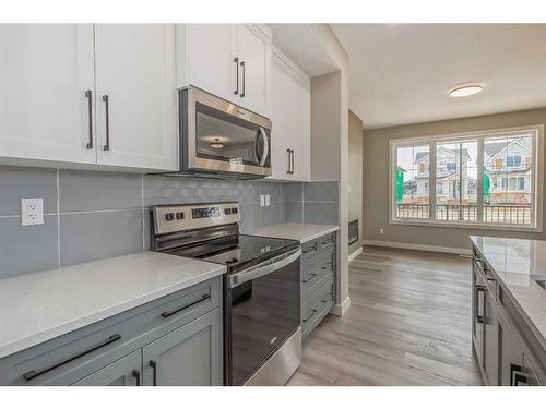 256 Waterford Heath, Chestermere, AB - Indoor Photo Showing Kitchen With Upgraded Kitchen