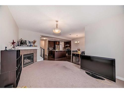 97 Panton Way Nw, Calgary, AB - Indoor With Fireplace