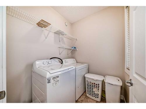 97 Panton Way Nw, Calgary, AB - Indoor Photo Showing Laundry Room