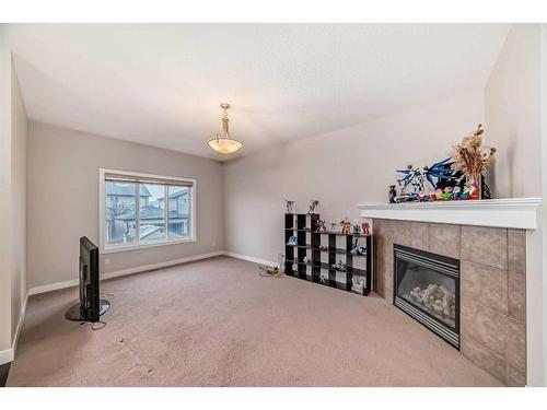 97 Panton Way Nw, Calgary, AB - Indoor With Fireplace