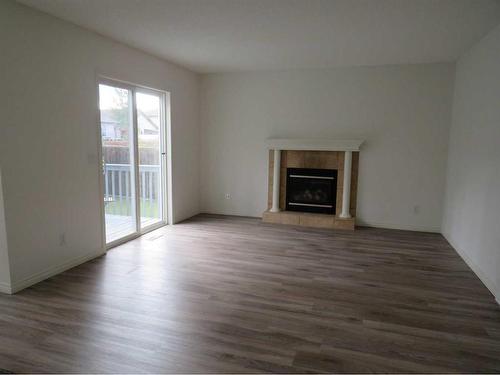 162 West Lakeview Crescent, Chestermere, AB - Indoor Photo Showing Living Room With Fireplace