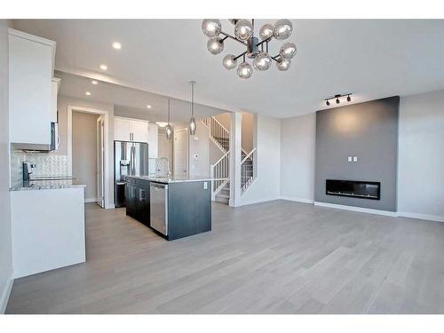 99 Waterford Manor, Chestermere, AB - Indoor Photo Showing Kitchen With Upgraded Kitchen