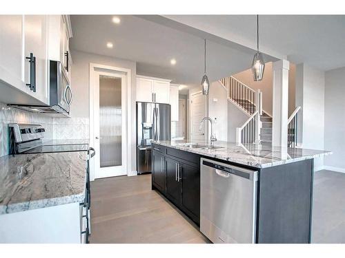 99 Waterford Manor, Chestermere, AB - Indoor Photo Showing Kitchen With Upgraded Kitchen